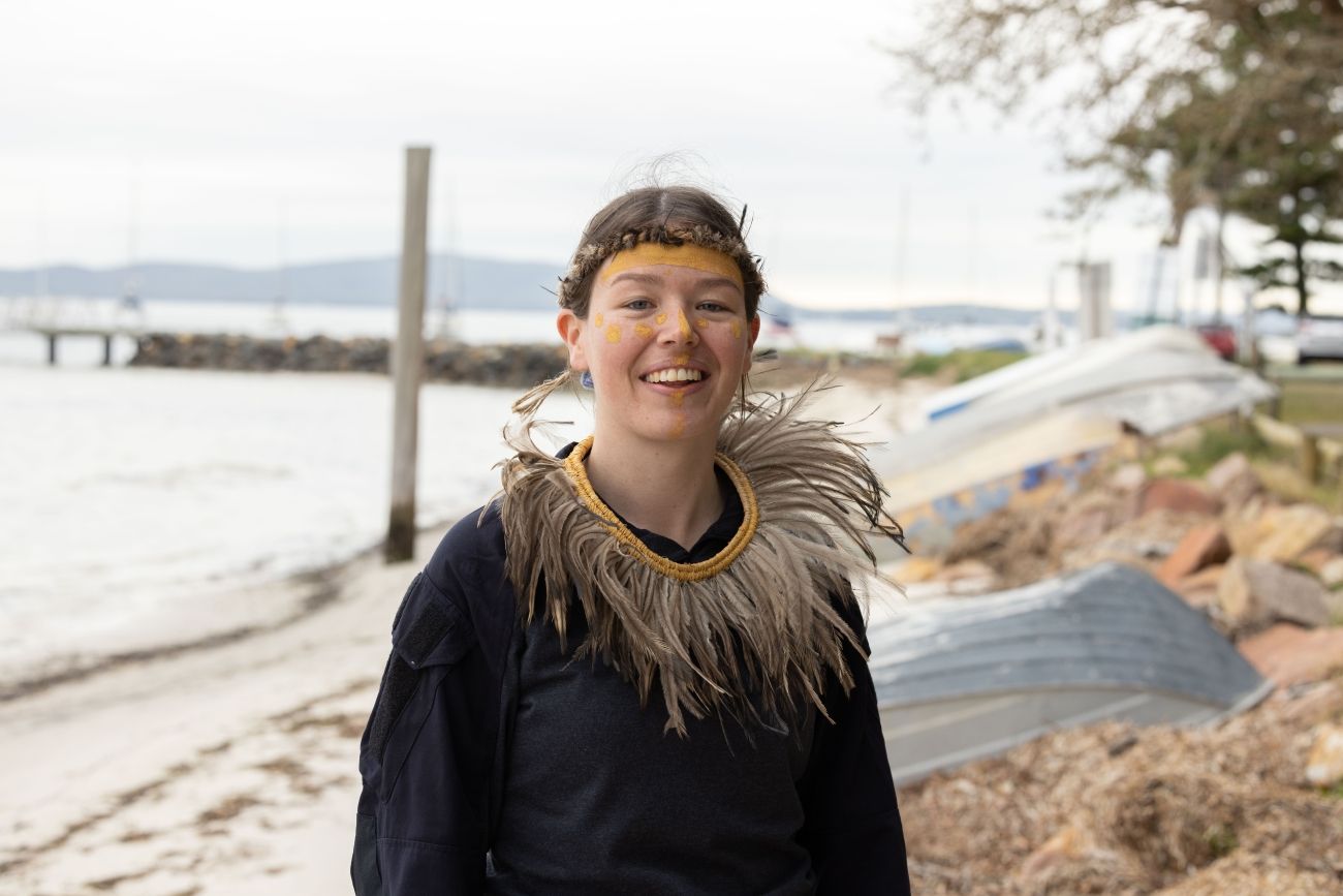 Worimi woman wearing aboriginal artefacts