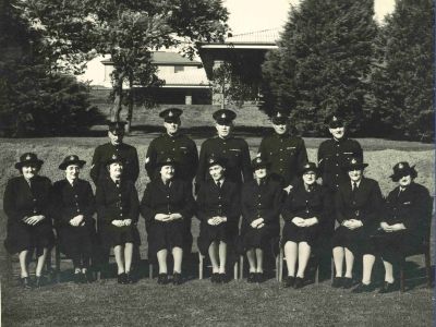 Members of the Defence Establishment Guard circa 1940, including 9 women seated in the front row (AFP MRN 12934)